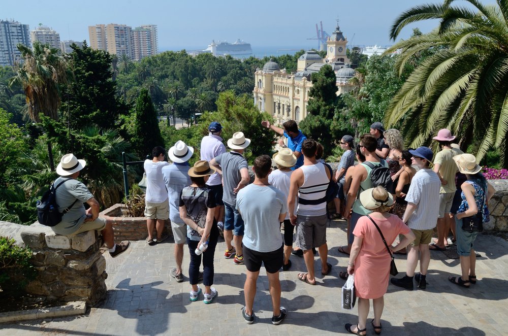 A Tour Group Listens To A Tour Guide