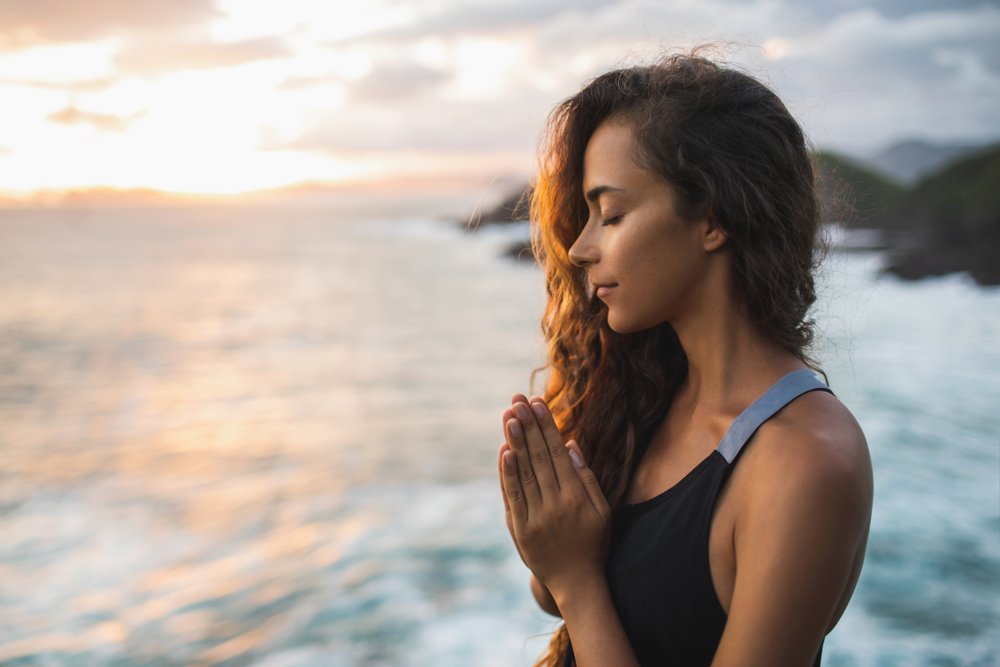woman praying and meditating